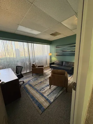 Sunlit therapy room with seating at Behavioral Health Intervention Center LLC, a detox center in Charlotte.
