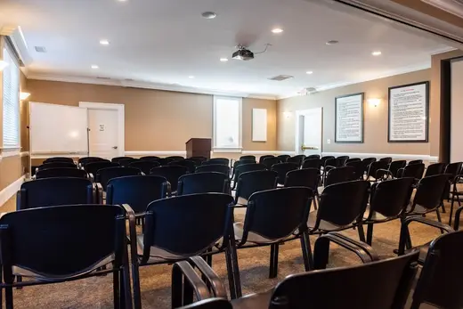 Spacious seminar room with chairs arranged for group sessions at a detox center in Charlotte.