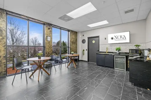 Modern kitchen with dining area in a sober living home in Charlotte.